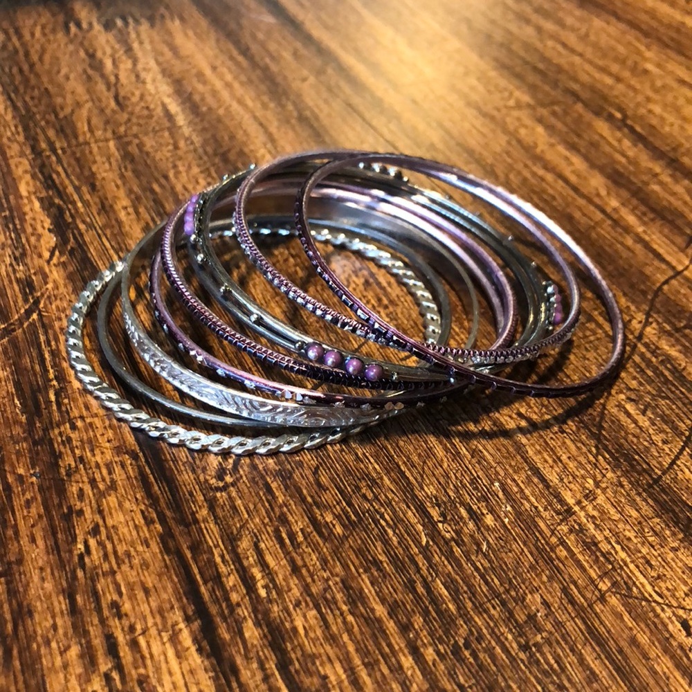 A ser of 10 purple and silver bangles